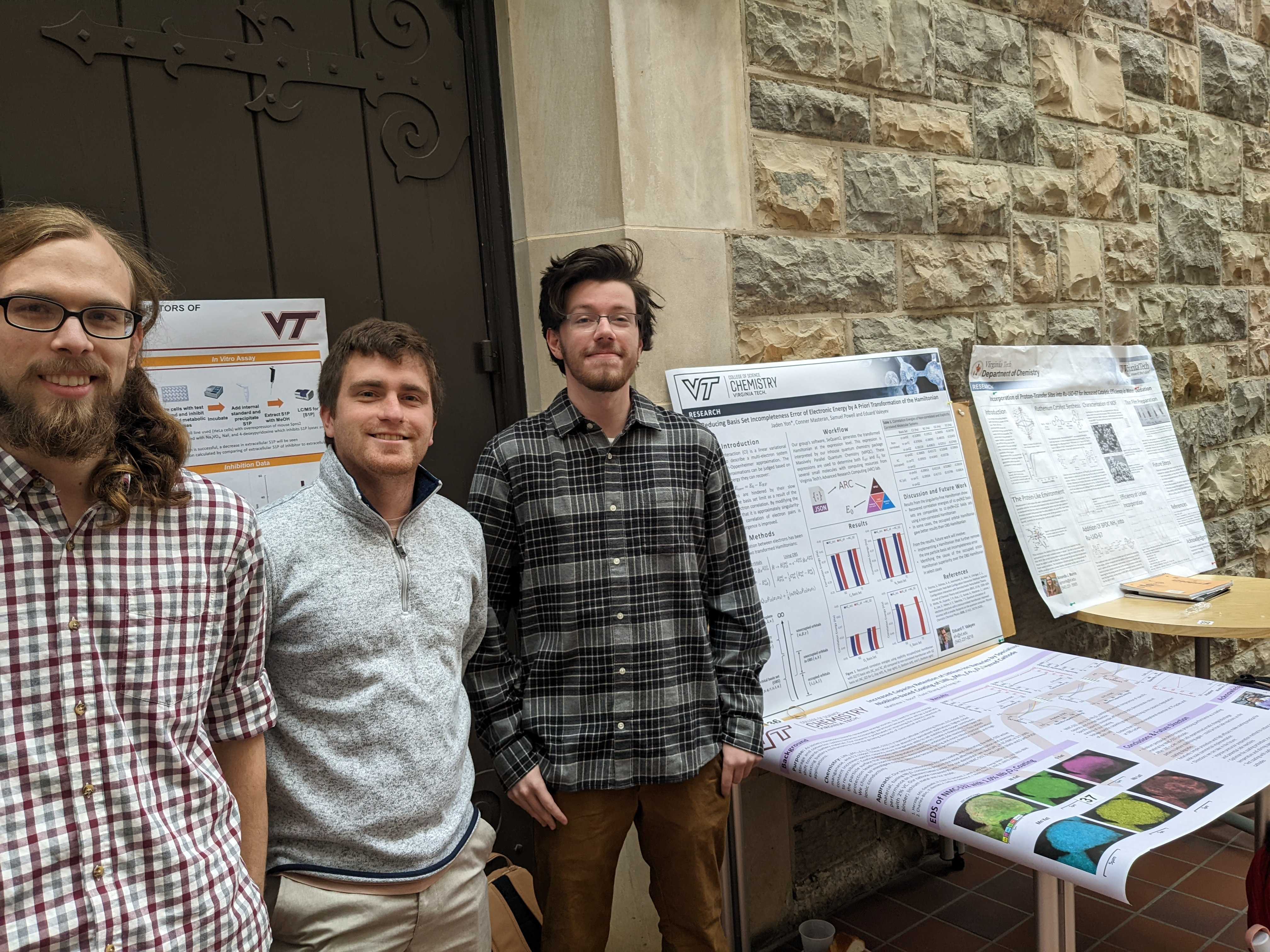 Jaden Yon and coworkers by the research poster