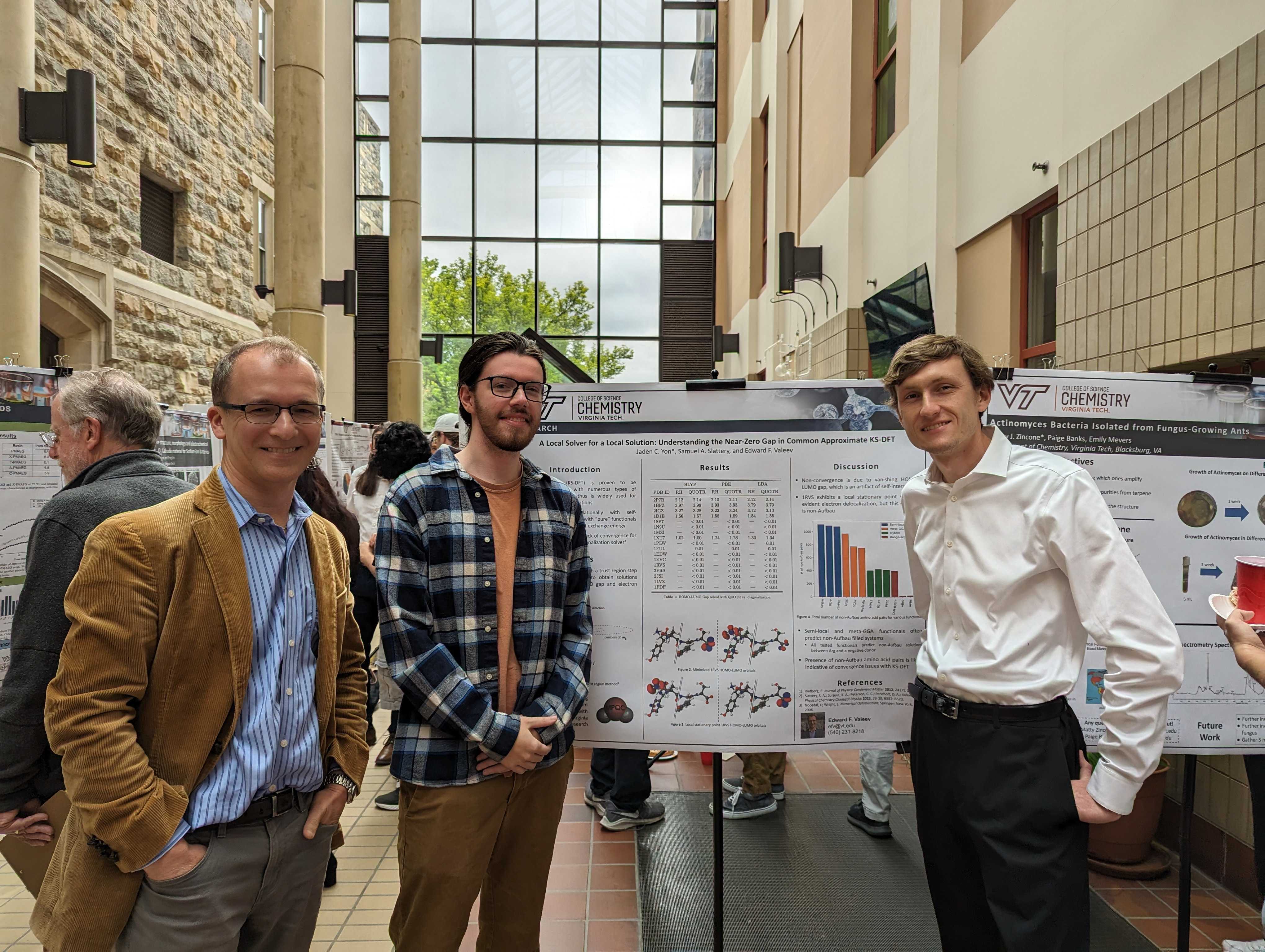 Professor Valeev, primary author Jaden Yon, and Sam Slattery by Jaden's postery at the undergraduate research symposium